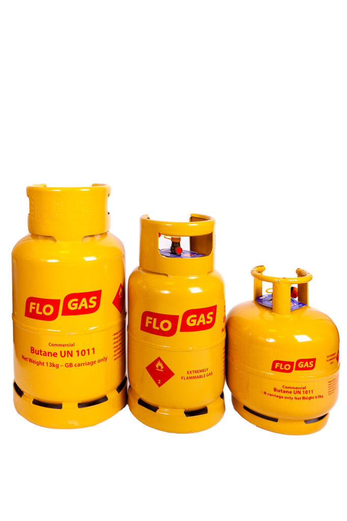 Three different sized yellow butane gas bottles